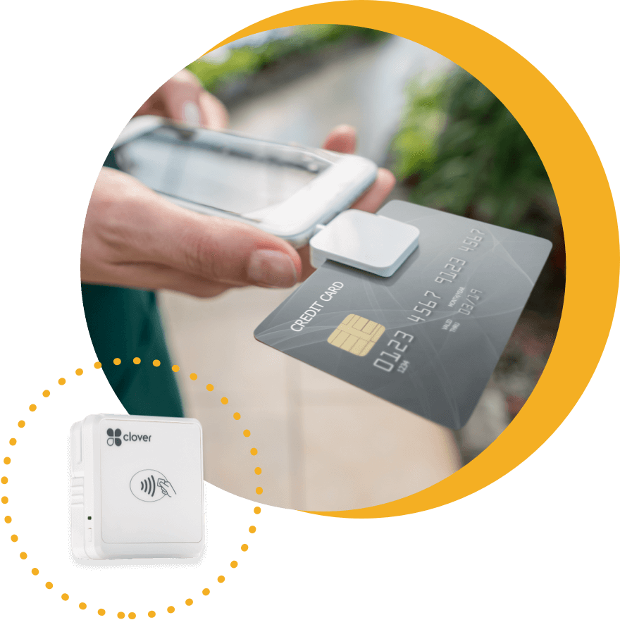 Clover mobile payment processing accessory attached to smart phone.