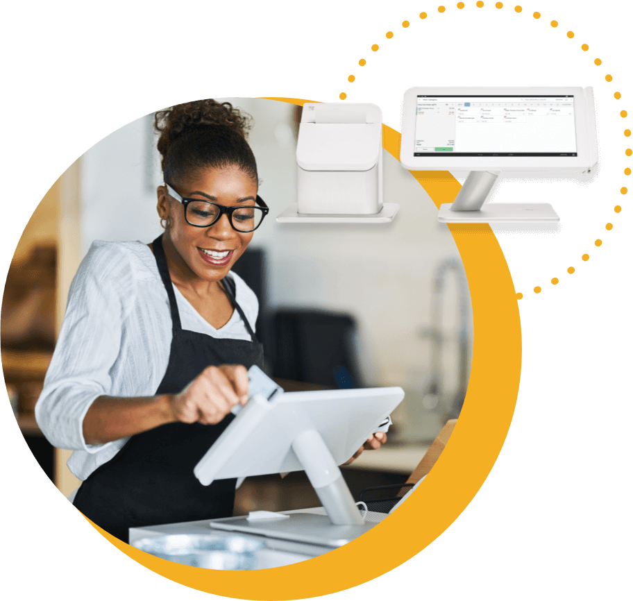 Woman using point of sale terminal to process credit card.